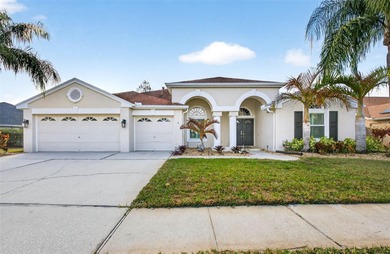 Situated on a rare 10,000+ sq ft lot in Westchase, this heated on Westchase Golf Club in Florida - for sale on GolfHomes.com, golf home, golf lot