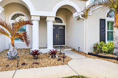 Situated on a rare 10,000+ sq ft lot in Westchase, this heated on Westchase Golf Club in Florida - for sale on GolfHomes.com, golf home, golf lot