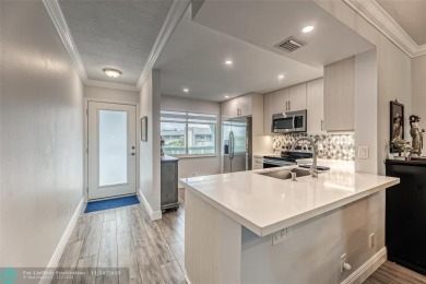 AN ABSOLUTE MUST SEE!! TOTALLY REMODELED PENTHOUSE UNIT. NEW CGI on Wynmoor Golf Course in Florida - for sale on GolfHomes.com, golf home, golf lot