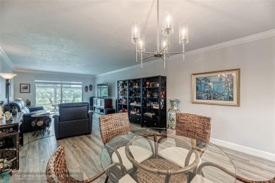 AN ABSOLUTE MUST SEE!! TOTALLY REMODELED PENTHOUSE UNIT. NEW CGI on Wynmoor Golf Course in Florida - for sale on GolfHomes.com, golf home, golf lot