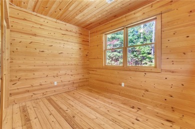 Welcome home to your new cabin nestled among trees backing up to on The Rock At Jocassee in South Carolina - for sale on GolfHomes.com, golf home, golf lot