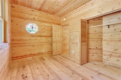 Welcome home to your new cabin nestled among trees backing up to on The Rock At Jocassee in South Carolina - for sale on GolfHomes.com, golf home, golf lot