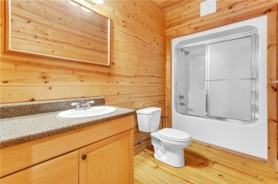 Welcome home to your new cabin nestled among trees backing up to on The Rock At Jocassee in South Carolina - for sale on GolfHomes.com, golf home, golf lot