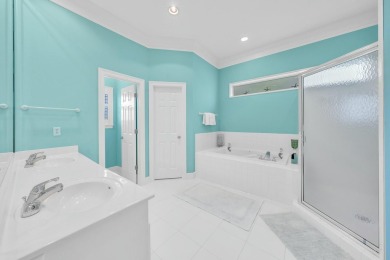 Experience coastal luxury at Sunshine Retreat nestled in the on Regatta Bay Golf and Country Club in Florida - for sale on GolfHomes.com, golf home, golf lot