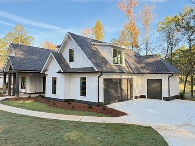 Perfectly sized with every upscale finish, this new home on Harbor Club Golf and Country Club in Georgia - for sale on GolfHomes.com, golf home, golf lot