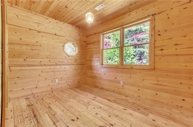 Welcome home to your new cabin nestled among trees backing up to on The Rock At Jocassee in South Carolina - for sale on GolfHomes.com, golf home, golf lot