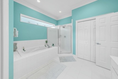Experience coastal luxury at Sunshine Retreat nestled in the on Regatta Bay Golf and Country Club in Florida - for sale on GolfHomes.com, golf home, golf lot