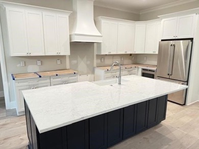 Perfectly sized with every upscale finish, this new home on Harbor Club Golf and Country Club in Georgia - for sale on GolfHomes.com, golf home, golf lot