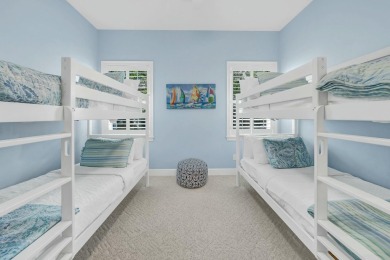 Experience coastal luxury at Sunshine Retreat nestled in the on Regatta Bay Golf and Country Club in Florida - for sale on GolfHomes.com, golf home, golf lot