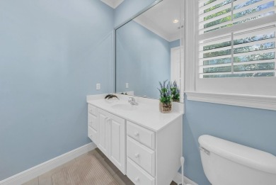 Experience coastal luxury at Sunshine Retreat nestled in the on Regatta Bay Golf and Country Club in Florida - for sale on GolfHomes.com, golf home, golf lot