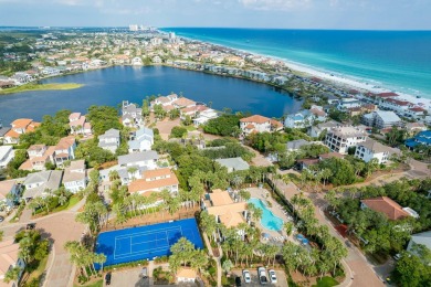 Experience coastal luxury at Sunshine Retreat nestled in the on Regatta Bay Golf and Country Club in Florida - for sale on GolfHomes.com, golf home, golf lot
