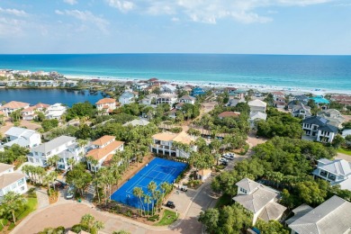 Experience coastal luxury at Sunshine Retreat nestled in the on Regatta Bay Golf and Country Club in Florida - for sale on GolfHomes.com, golf home, golf lot