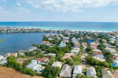 Experience coastal luxury at Sunshine Retreat nestled in the on Regatta Bay Golf and Country Club in Florida - for sale on GolfHomes.com, golf home, golf lot