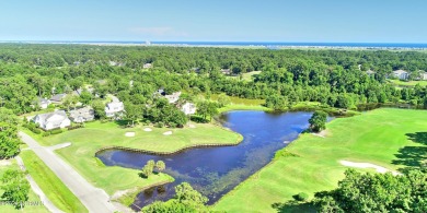 This impressive custom built home sits on a corner lot and on Oyster Bay Golf Links in North Carolina - for sale on GolfHomes.com, golf home, golf lot
