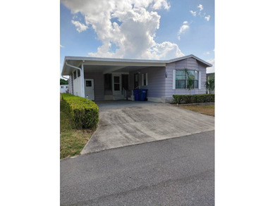Don't miss this single-wide home in the popular Hidden Golf a on Lake Henry Golf Club in Florida - for sale on GolfHomes.com, golf home, golf lot