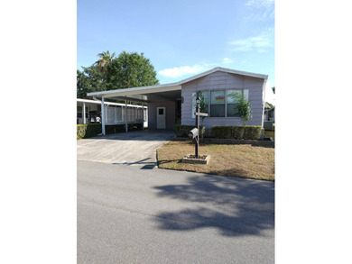 Don't miss this single-wide home in the popular Hidden Golf a on Lake Henry Golf Club in Florida - for sale on GolfHomes.com, golf home, golf lot