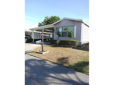 Don't miss this single-wide home in the popular Hidden Golf a on Lake Henry Golf Club in Florida - for sale on GolfHomes.com, golf home, golf lot