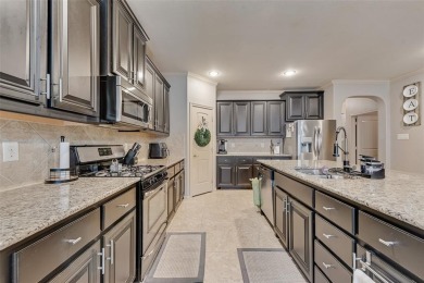 Step into this beautifully maintained showcase home, where on The Golf Club At Champions Circle in Texas - for sale on GolfHomes.com, golf home, golf lot