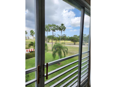 Enjoy the view of the beautiful Poinciana Golf Course and pool on Poinciana Golf Club in Florida - for sale on GolfHomes.com, golf home, golf lot