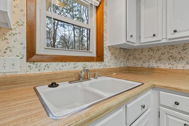 Welcome to this charming bungalow nestled in the heart of Hot on Cortez Golf Course in Arkansas - for sale on GolfHomes.com, golf home, golf lot