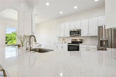 This stunning, fully REMODELED barrel tile roof Verona model on Stonegate Golf Club in Florida - for sale on GolfHomes.com, golf home, golf lot
