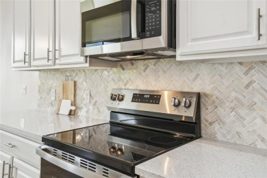 This stunning, fully REMODELED barrel tile roof Verona model on Stonegate Golf Club in Florida - for sale on GolfHomes.com, golf home, golf lot