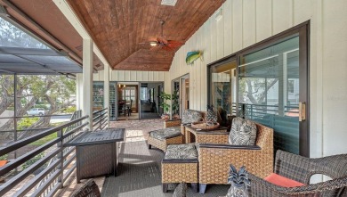 Immerse yourself in the timeless charm of West Indies-style on Longboat Key Golf Club Resort in Florida - for sale on GolfHomes.com, golf home, golf lot