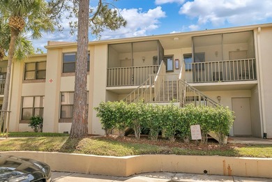2ND FLOOR CONDO WITH PRIVATE GARAGE IN GUARDED/GATED COMMUNITY! on Feather Sound Country Club in Florida - for sale on GolfHomes.com, golf home, golf lot