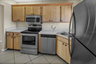 2ND FLOOR CONDO WITH PRIVATE GARAGE IN GUARDED/GATED COMMUNITY! on Feather Sound Country Club in Florida - for sale on GolfHomes.com, golf home, golf lot