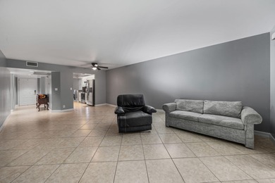 Wake up to peaceful water views and end your evenings surrounded on Wynmoor Golf Course in Florida - for sale on GolfHomes.com, golf home, golf lot