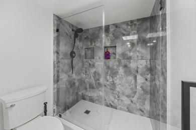 Wake up to peaceful water views and end your evenings surrounded on Wynmoor Golf Course in Florida - for sale on GolfHomes.com, golf home, golf lot