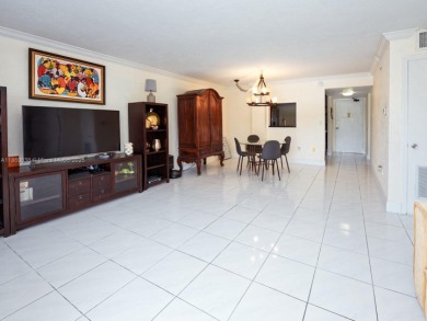 Spacious 2 bedroom, 2 bathroom home filled with natural sunlight on Normandy Shores Golf Course in Florida - for sale on GolfHomes.com, golf home, golf lot