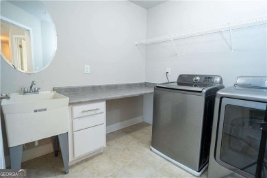 This stunning, *practically new*, and move-in ready home, sits on Reunion Golf Club in Georgia - for sale on GolfHomes.com, golf home, golf lot