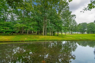 Welcome inside this light-filled home located on the 1st fairway on Chenal Country Club - Bear Den Mountain in Arkansas - for sale on GolfHomes.com, golf home, golf lot