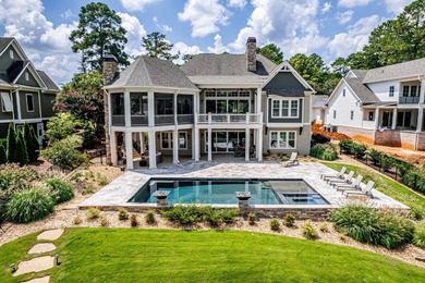Luxury Lakefront Living. Welcome to 131 Cape View Lane, located on The Golf Club at Cuscowilla in Georgia - for sale on GolfHomes.com, golf home, golf lot