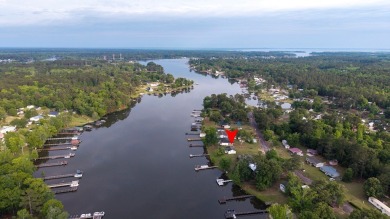 Enjoy boating, fishing & swimming from this recently renovated on Players Course At Wyboo Plantation in South Carolina - for sale on GolfHomes.com, golf home, golf lot