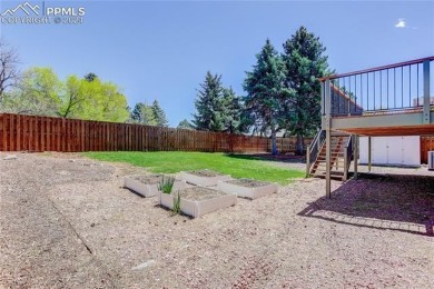 Tucked away with no rear neighbors, this home sits in the serene on Colorado Springs Country Club in Colorado - for sale on GolfHomes.com, golf home, golf lot