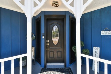 Nestled on a beautifully positioned corner lot directly across on Clearwater Country Club in Florida - for sale on GolfHomes.com, golf home, golf lot