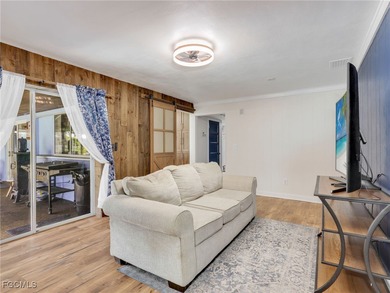 Beautiful 4-bedroom, 2-bath pool home in the highly desirable on Cypress Lake Country Club in Florida - for sale on GolfHomes.com, golf home, golf lot