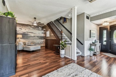 Nestled on a beautifully positioned corner lot directly across on Clearwater Country Club in Florida - for sale on GolfHomes.com, golf home, golf lot
