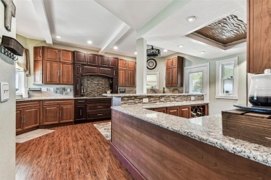Nestled on a beautifully positioned corner lot directly across on Clearwater Country Club in Florida - for sale on GolfHomes.com, golf home, golf lot