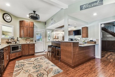 Nestled on a beautifully positioned corner lot directly across on Clearwater Country Club in Florida - for sale on GolfHomes.com, golf home, golf lot