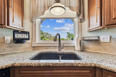 Nestled on a beautifully positioned corner lot directly across on Clearwater Country Club in Florida - for sale on GolfHomes.com, golf home, golf lot