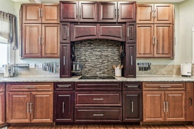 Nestled on a beautifully positioned corner lot directly across on Clearwater Country Club in Florida - for sale on GolfHomes.com, golf home, golf lot