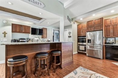 Nestled on a beautifully positioned corner lot directly across on Clearwater Country Club in Florida - for sale on GolfHomes.com, golf home, golf lot