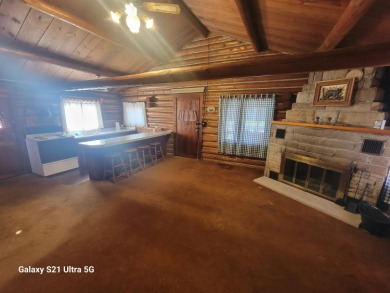 Charming updated and well kept log cabin just 3 homes from the on Pine View Highlands Golf Course in Michigan - for sale on GolfHomes.com, golf home, golf lot