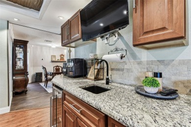 Nestled on a beautifully positioned corner lot directly across on Clearwater Country Club in Florida - for sale on GolfHomes.com, golf home, golf lot