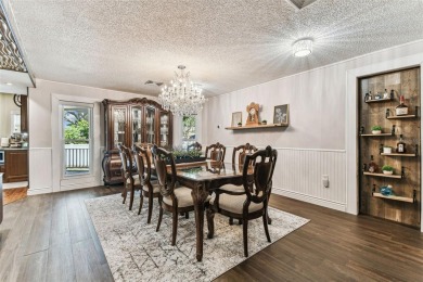 Nestled on a beautifully positioned corner lot directly across on Clearwater Country Club in Florida - for sale on GolfHomes.com, golf home, golf lot