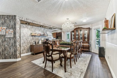 Nestled on a beautifully positioned corner lot directly across on Clearwater Country Club in Florida - for sale on GolfHomes.com, golf home, golf lot