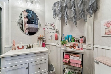 Nestled on a beautifully positioned corner lot directly across on Clearwater Country Club in Florida - for sale on GolfHomes.com, golf home, golf lot